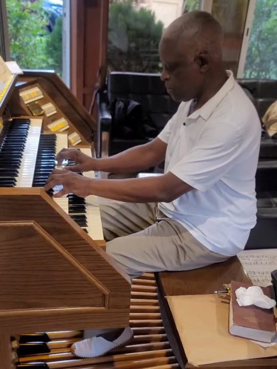 James Otieno at the organ console